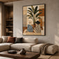 Leafside Companions painting above a pale sectional sofa with warm accent cushions and a wooden coffee table.