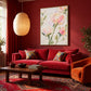 Blush Petals painting above a red sofa beneath a paper pendant lamp in a rich red living room.