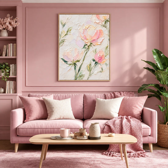Blush Petals painting above a pink sofa with white cushions and a light wooden coffee table.