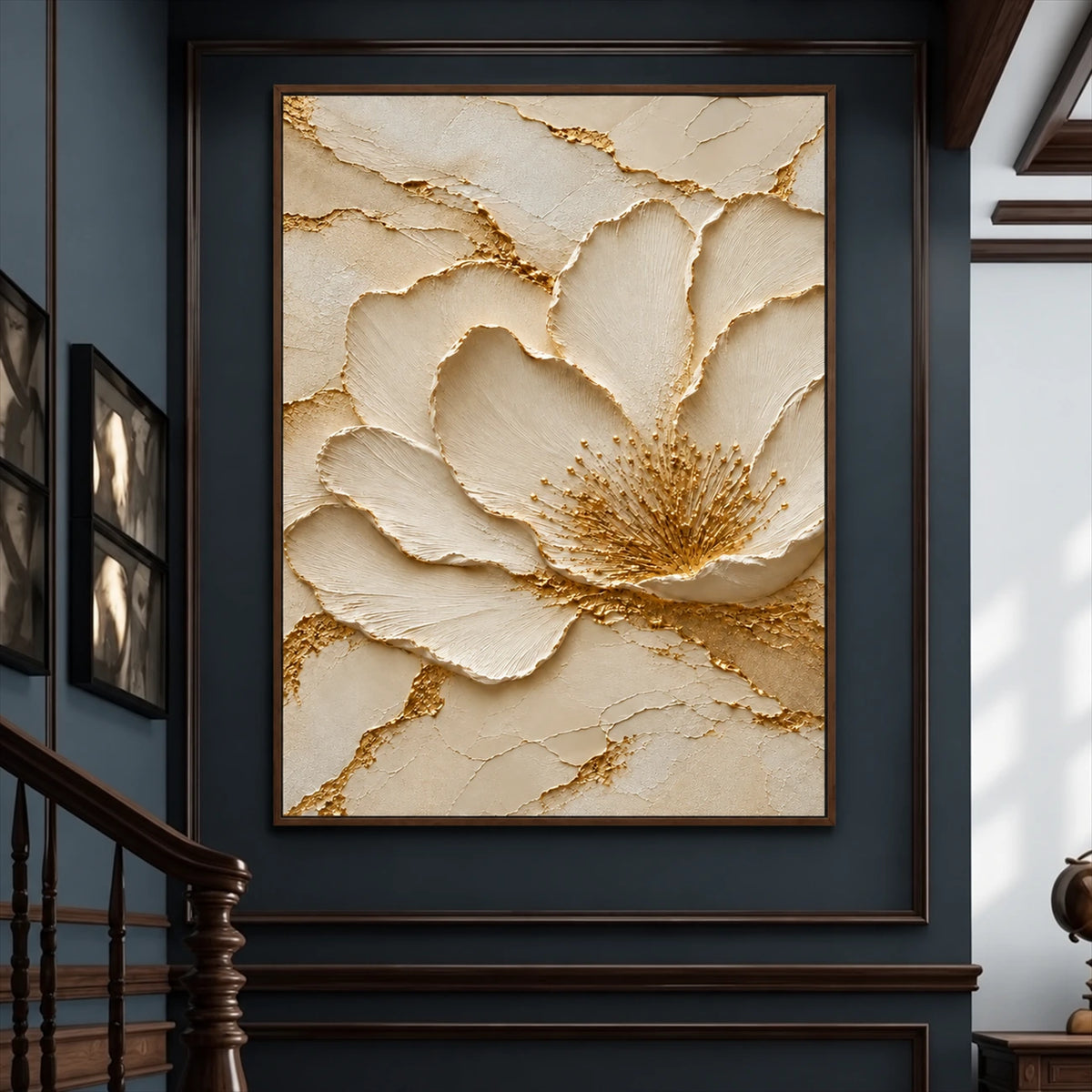 Gilded Blossom painting on a dark blue paneled wall beside a staircase.