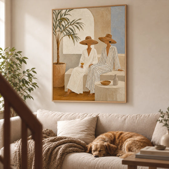 Terrace Companions painting above a pale sofa with a resting dog in a sunlit living room.