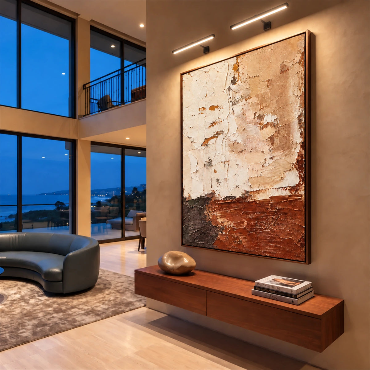 Earthen Layers painting above a floating wooden console in a tall contemporary interior at dusk.