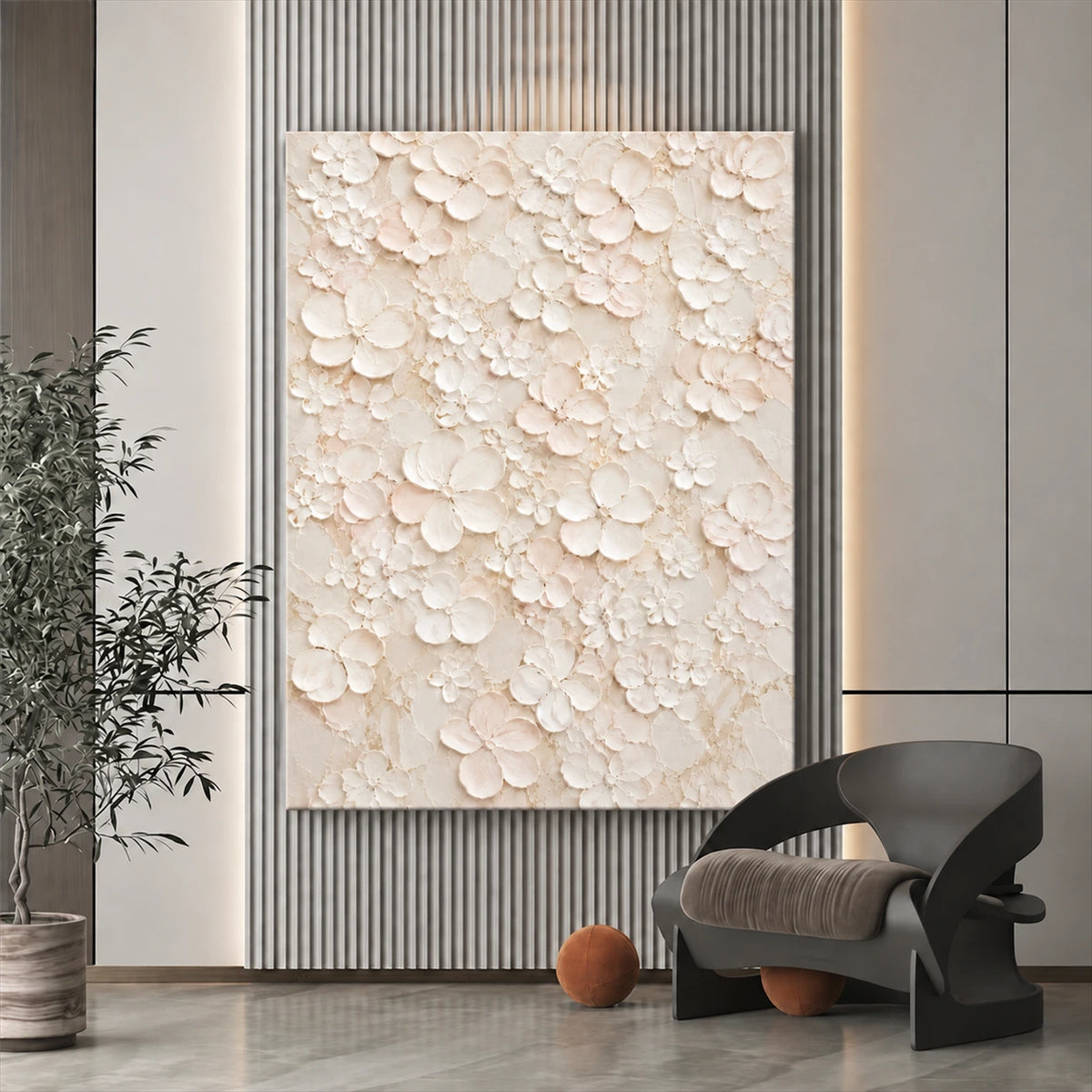 Ivory Petal Garden canvas on a vertically ribbed wall beside a dark sculptural chair and leafy plant.