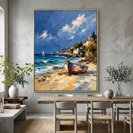 Sunlit Cove painting above a pale dining table and wooden chairs in a bright neutral room.