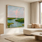 Marshlight Reverie painting above a cream sectional beside a large window.