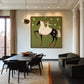 Starlit Rider painting above a dark dining table in a sunlit room.