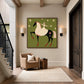 Starlit Rider painting above a beige armchair beside a staircase.