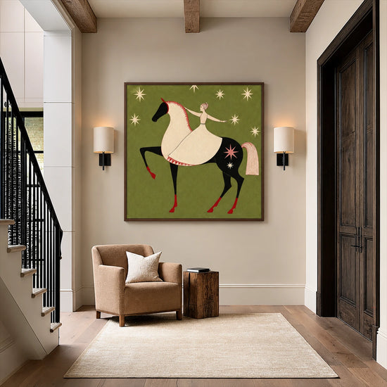 Starlit Rider painting above a beige armchair beside a staircase.