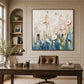 Blush Meadow painting above a wooden desk and leather office chair.