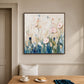 Blush Meadow painting above a breakfast bench beside a wooden table.