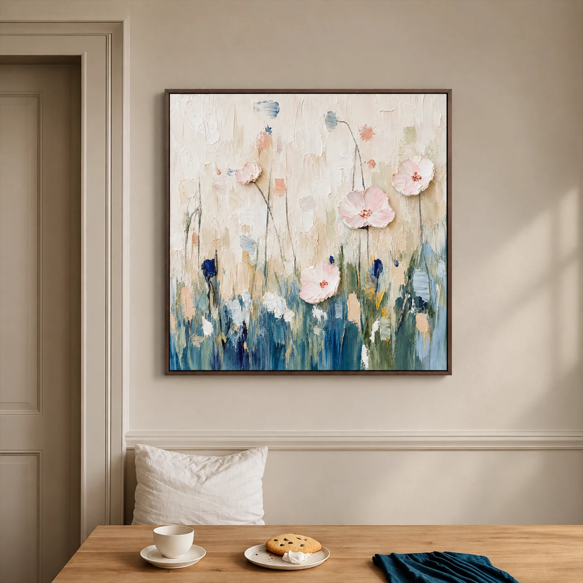 Blush Meadow painting above a breakfast bench beside a wooden table.