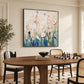 Blush Meadow painting above a wooden dining table with a chessboard.