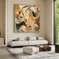 Ochre Fragments painting above a cream sofa and pale ottoman.