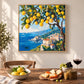 Lemon Coast painting above a dining table set with lemons and a wine glass.