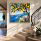 Lemon Coast painting beside a curved staircase in a sunlit entryway.