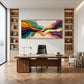 Chromatic Strata painting above a wooden desk between built-in shelves.