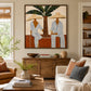 Palmside Leisure painting above a wooden sideboard in a sunlit living room.