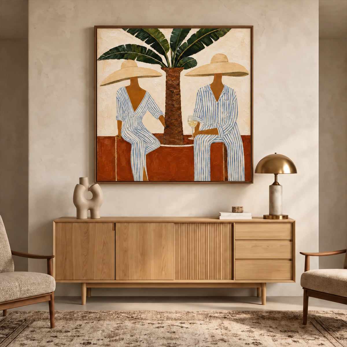 Palmside Leisure painting above a light wooden sideboard beside a brass-toned lamp.