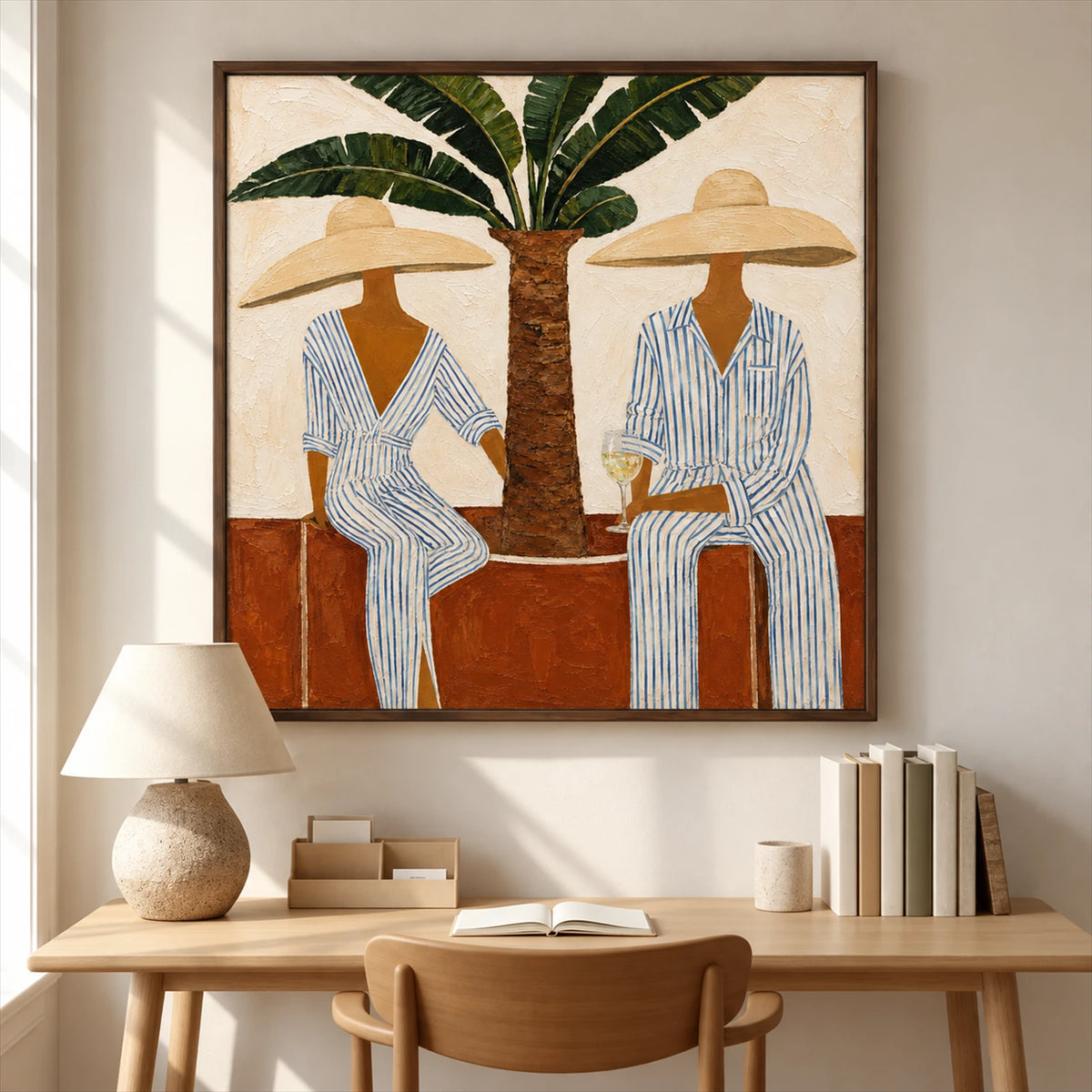 Palmside Leisure painting above a wooden desk beside a sunlit window.