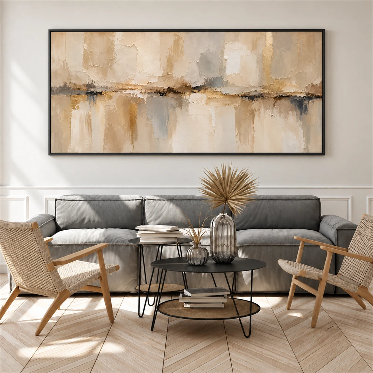 Sandstone Reflection painting above a gray sofa and round black coffee table.