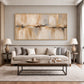 Sandstone Reflection painting above a cream sofa between matching table lamps.