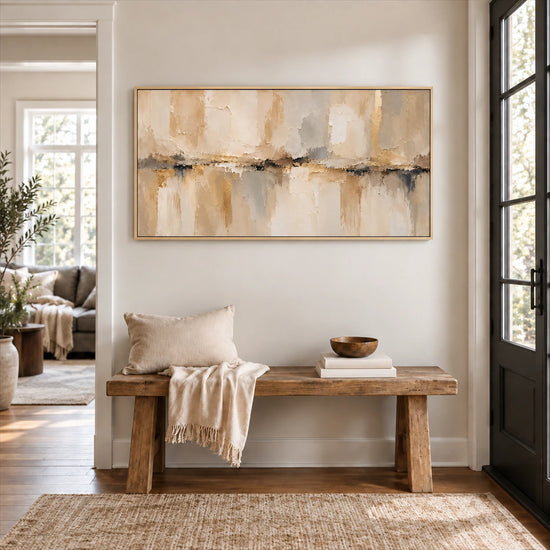 Sandstone Reflection painting above a wooden entry bench with neutral textiles.