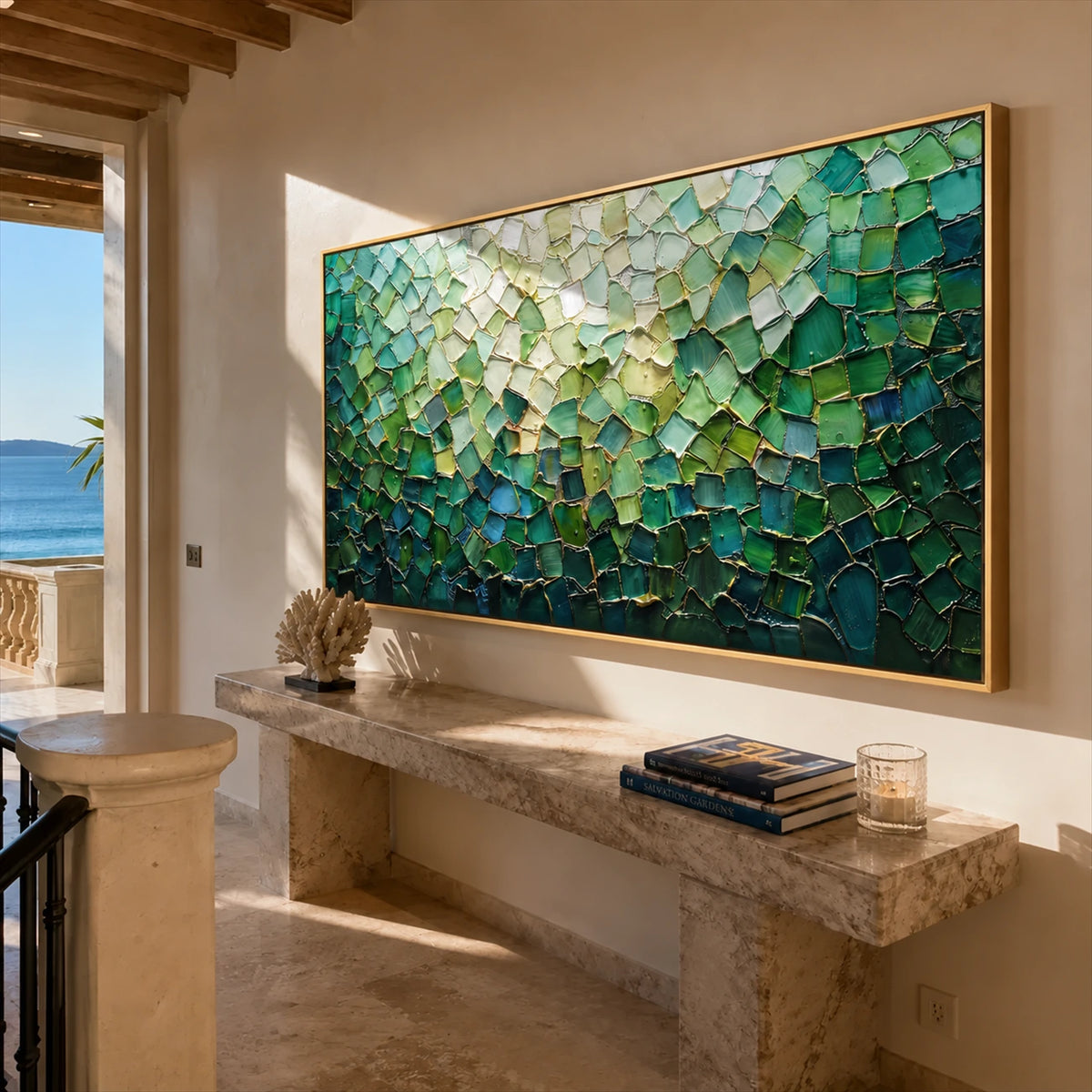 Jade Tesserae painting above a stone console beside a sea-facing window.