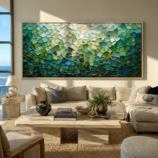 Jade Tesserae painting above a cream sectional in a bright coastal living room.
