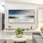 Silver Stillwater painting above a low white console beside a garden-facing window.