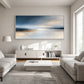 Silver Stillwater painting above a white sideboard between pale sofas.