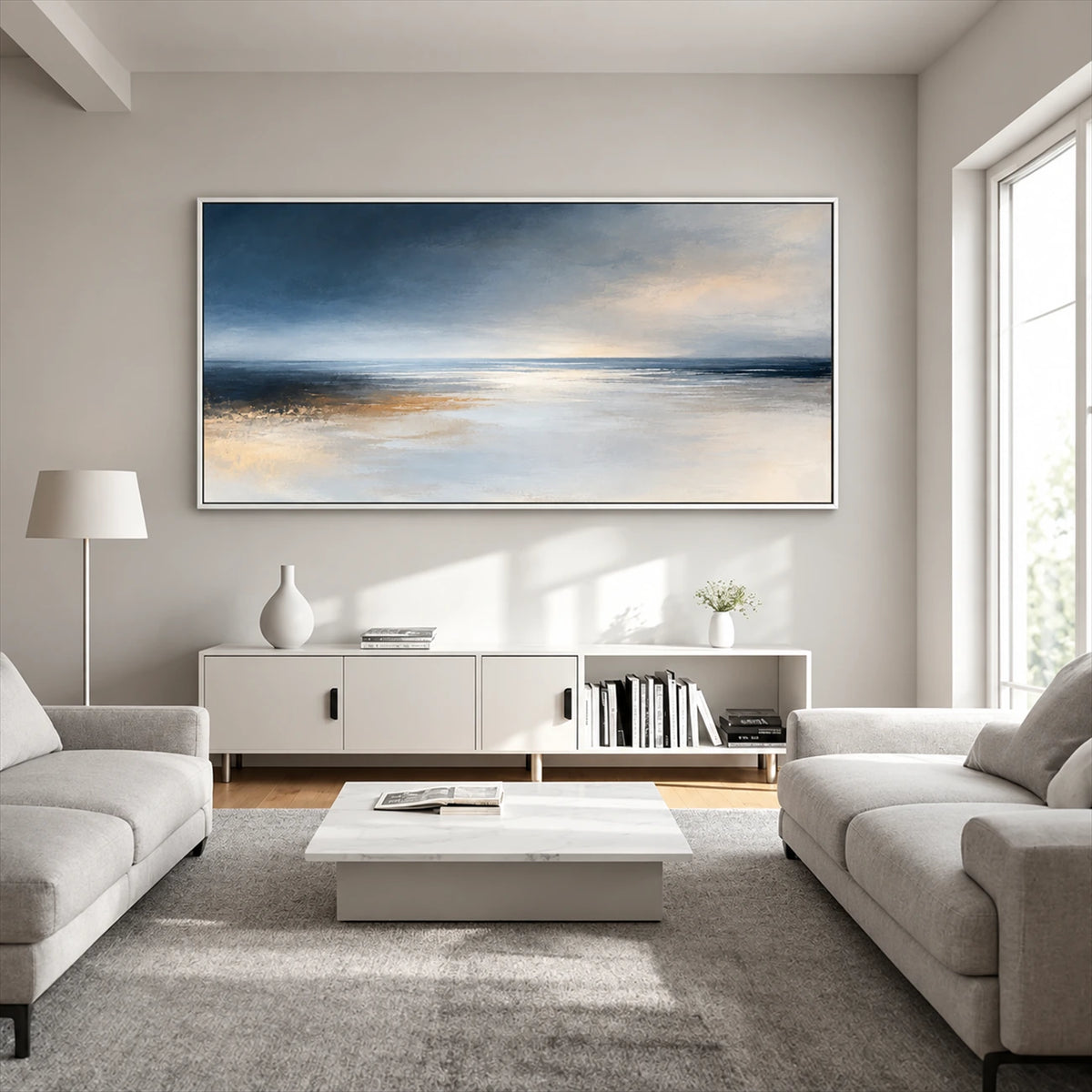 Silver Stillwater painting above a white sideboard between pale sofas.