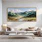 Alpine Waterways painting above a cream sectional and light coffee table.