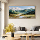 Alpine Waterways painting above a pale sofa with yellow flowers on a coffee table.