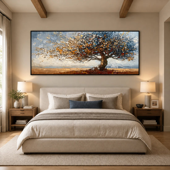 Autumn Radiance painting above an upholstered bed beneath exposed beams.