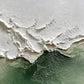 Ivory ridges sweep across a muted green field, their irregular edges recalling breaking surf viewed from above. Full 2:1 artwork without a frame.