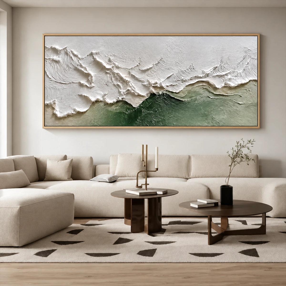 Sage Breakers painting above a cream sectional and dark round coffee tables.