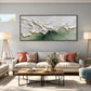 Sage Breakers painting above a pale sofa with coral cushions between floor lamps.
