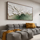 Sage Breakers painting above a gray sectional with mustard cushions.