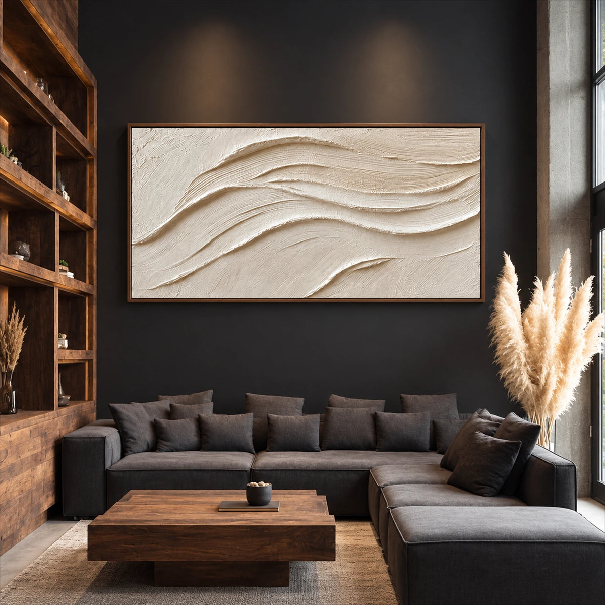 Linen Dunes painting above a dark sectional beside tall wooden shelving.