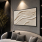 Linen Dunes painting above a curved pale sofa against a dark paneled wall.