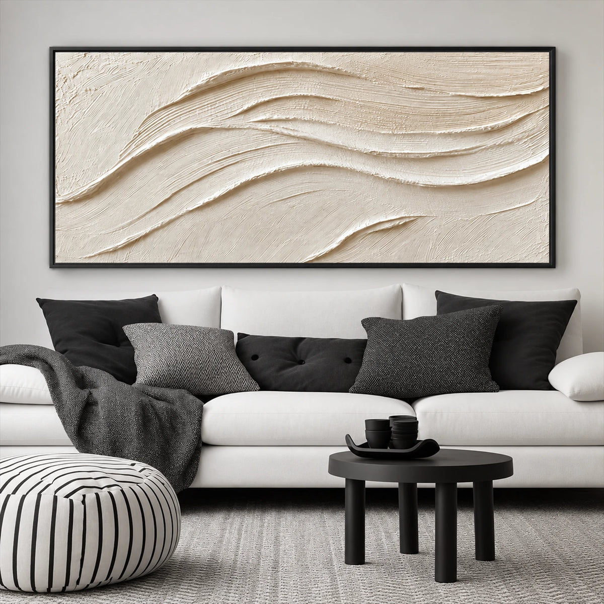 Linen Dunes painting above a white sofa with black cushions and round tables.