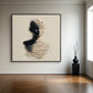 Sculpted Silence artwork above a parquet floor beside a black pedestal and vase.