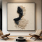 Sculpted Silence artwork between two lounge chairs above a low round coffee table.