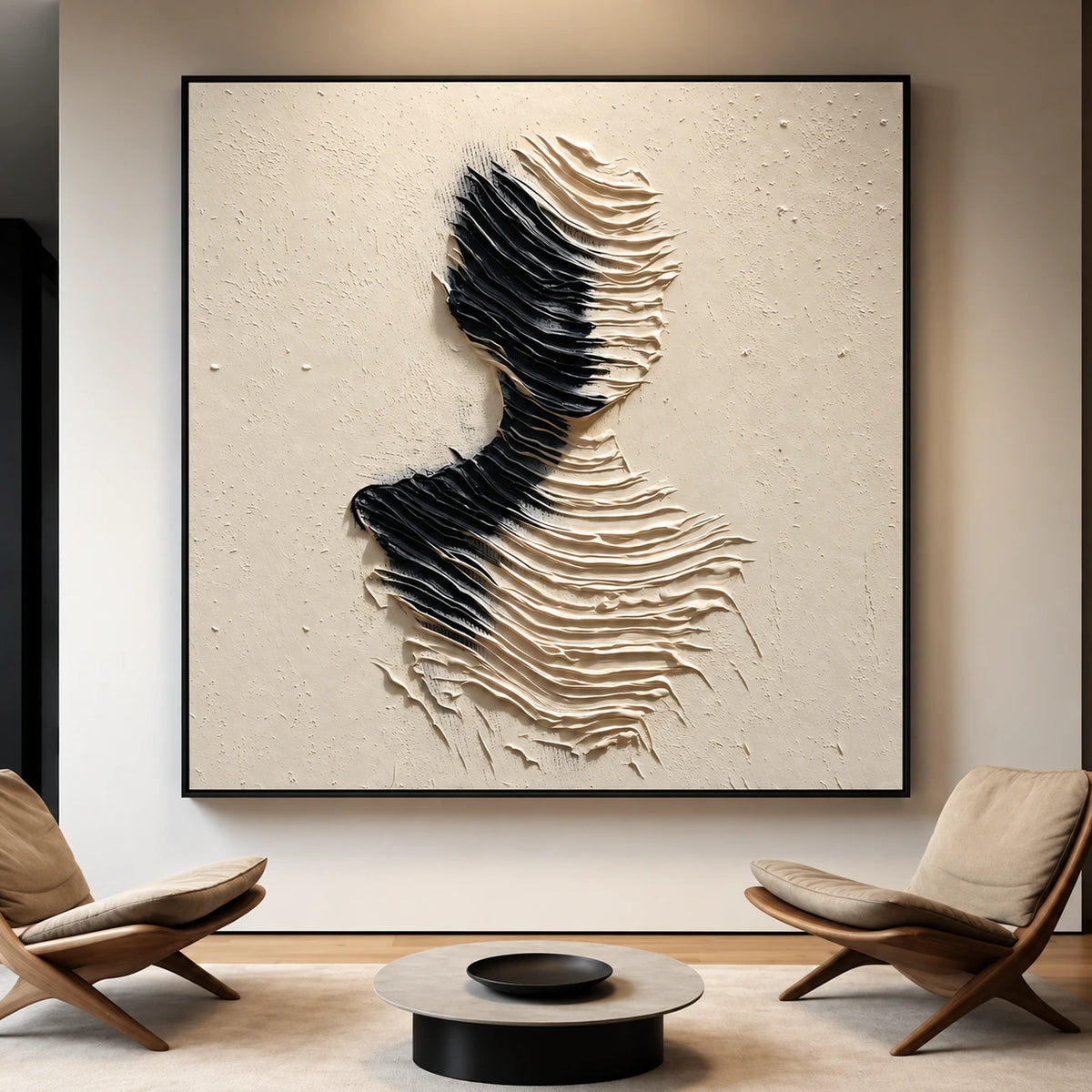 Sculpted Silence artwork between two lounge chairs above a low round coffee table.