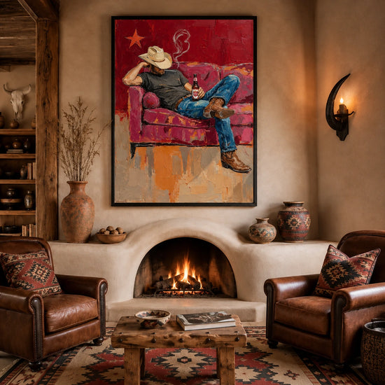Cowboy Siesta artwork above an adobe fireplace between two leather chairs.