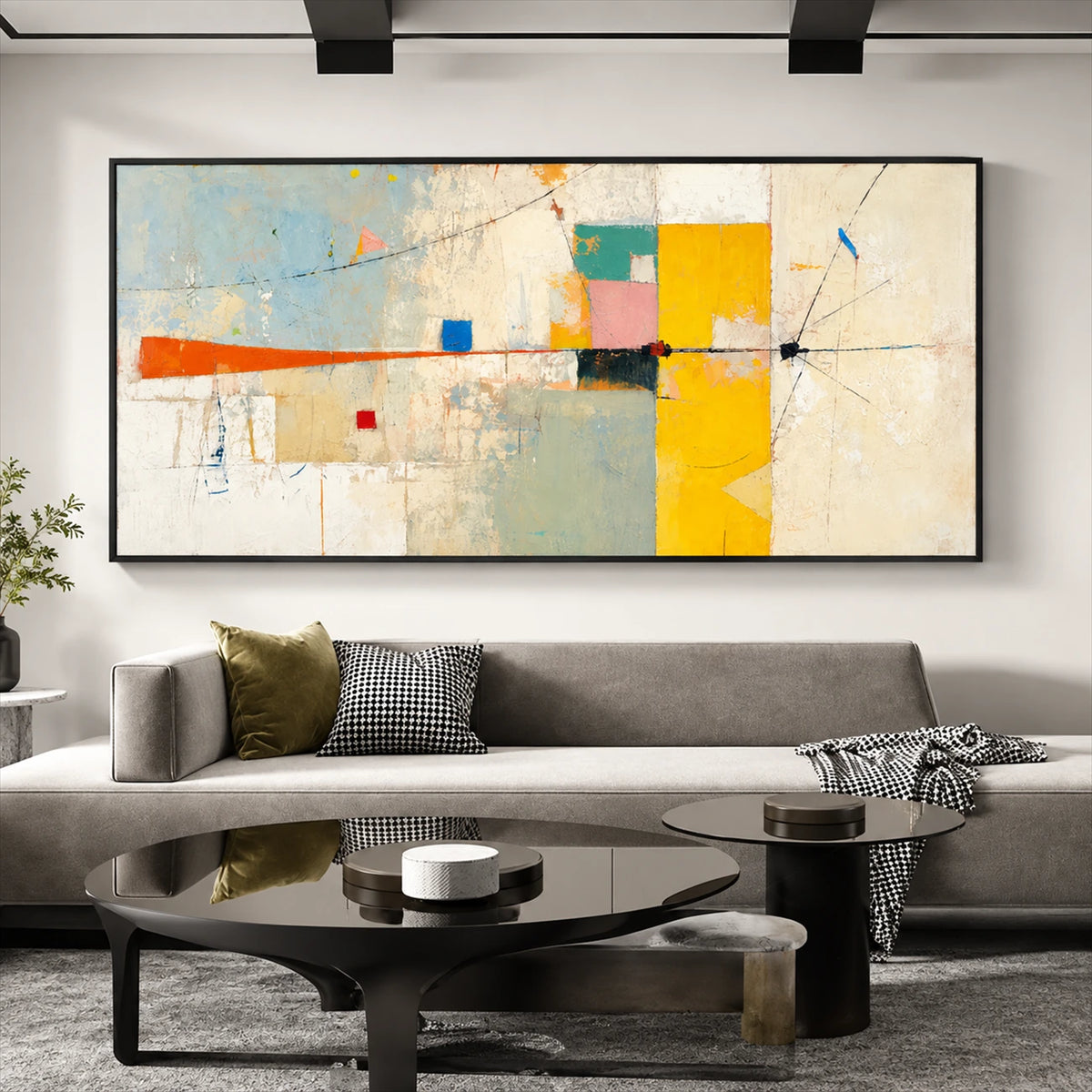 Citrine Balance painting above a gray sofa and sculptural black coffee table.