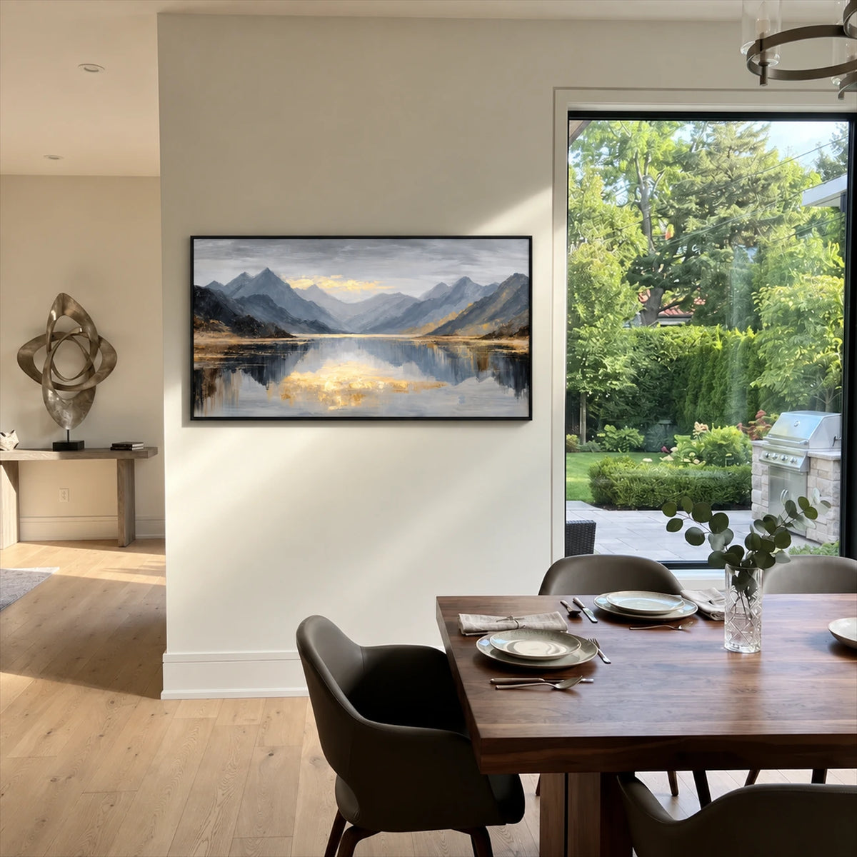 Mountain Stillness painting beside a wooden dining table and a glass garden door.