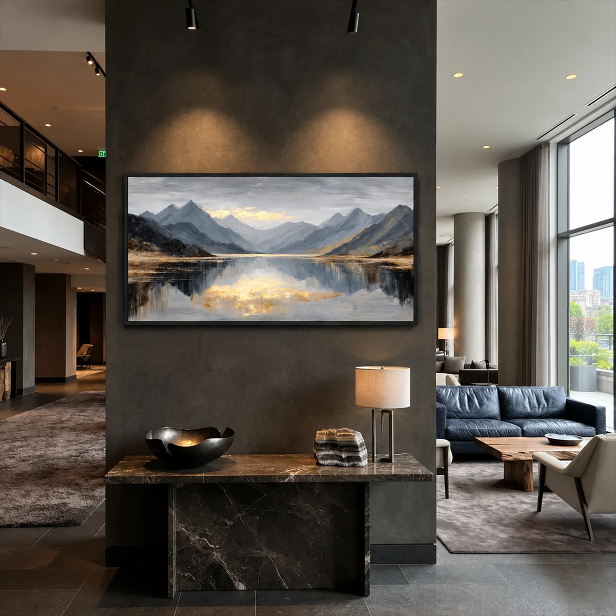 Mountain Stillness painting on a tall dark wall above a console in an open living room.