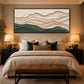 Sage Contours painting above a bed with green accent cushions.