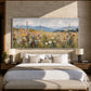 Meadow Distance painting above a bed against a textured stone wall.